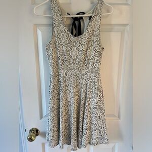 Black and white skater dress with tie back bow. Size Small